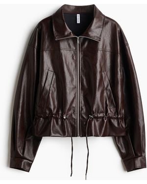 H&M Jacke mit Coating und Stehkragen - Schwarz