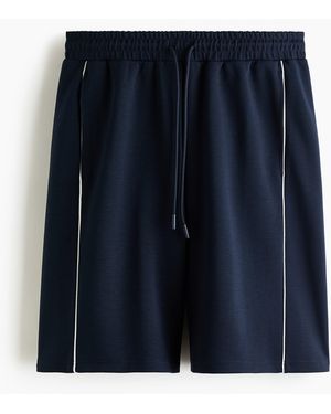 H&M Sportshorts mit DryMove in Loose Fit - Blau