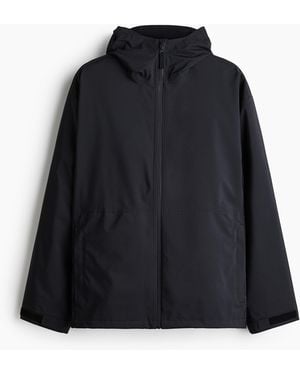 H&M Packbare Regenjacke mit StormMove - Schwarz