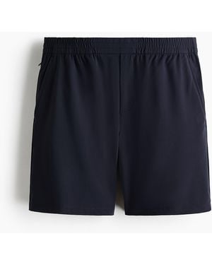 H&M Shorts mit Vierwegestretch in Regular Fit - Blau