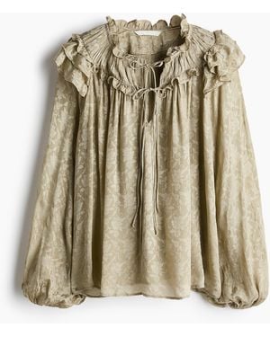 H&M Bluse mit Volantbesätzen und Bindebändern - Mettallic