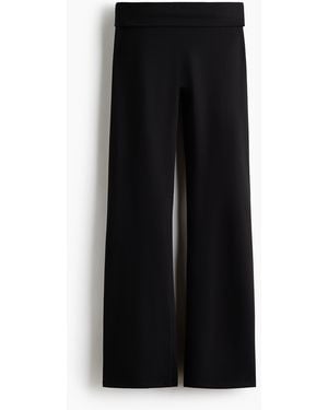 H&M Ausgestellte Yogaleggings mit SoftMove - Schwarz