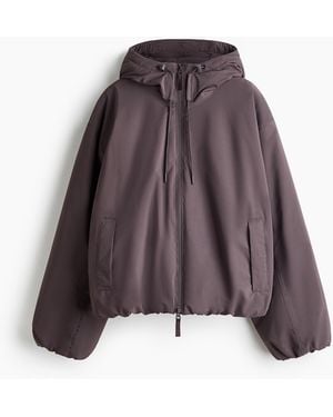 H&M Wattierte Sport-Regenjacke mit StormMove - Braun