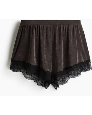H&M Glänzende Shorts mit Spitze - Schwarz