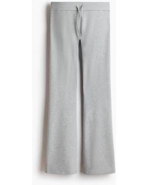 H&M Ausgestellte Yoga-Joggpants mit SoftMove - Grau