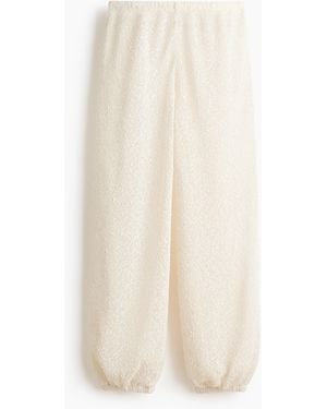 H&M Glitzernde Strickhose - Weiß