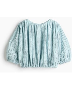 H&M Bluse aus Strukturstoff mit Ballonsaum - Blau