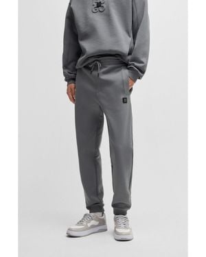 HUGO Cotton-Blend Tracksuit Bottoms With Stacked Logo - Grey