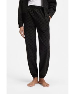 HUGO Relaxed-Fit Tracksuit Bottoms With Flocked-Logo Print - Black