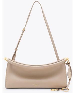 Alaïa Leather Le Click East West Small Crossbody Bag - Natural