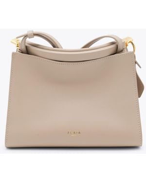 Alaïa Leather Small Square Crossbody Bag - Natural