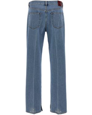 デニム・ジーパン Patchwork denim jeans with gucci rosso ancora Gucci Patchwork Denim Jeans With Rosso Ancora in Blue | Lyst