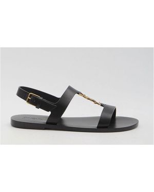 サンダル SAINT LAURENT Men Sandals 6059511P210 1000 BLACK CASSANDRE slides in smooth leather | Saint Laurent | YSL US