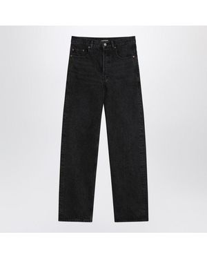 Saint Laurent Carrot-Fit Jeans With A Washed Effect in Black