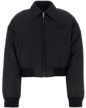 ダウンジャケット・コート Miu Miu Recycled Polyester Hooded Down Jacket Miu Miu Recycled Polyester Hooded Down Jacket in Black | Lyst