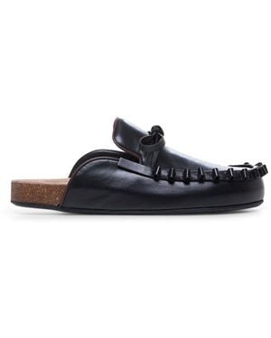 サンダル・ミュール Jw Anderson  Slippers and Clogs Women Leather Black JW ANDERSON | Black Women's Mules And Clogs | YOOX