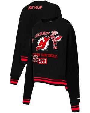 Pro Standard New Jersey Devils Area Code Cropped Pullover Sweatshirt - Black