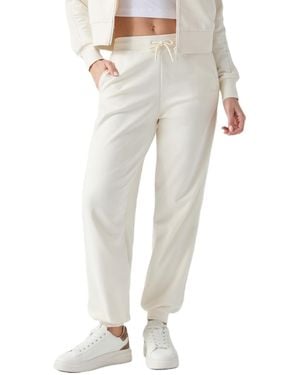 Guess Phoebe High-rise Active-knit Cotton-blend jogger - Natural