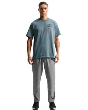 Nike N.A.C. Loose Fit Katoenen T-Shirt - Blauw