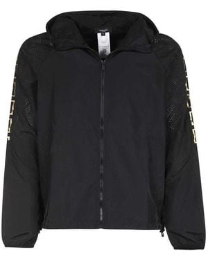 Versace Schwarze jacke mit perforiertem detail und kordelzugkapuze