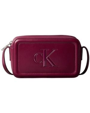Calvin Klein Cross Body Bags - Purple