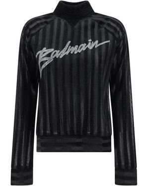 Balmain Maglione nero con dettaglio logo in cristallo