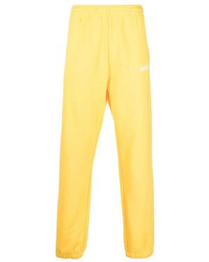 Jacquemus Pantalones de chándal con logo estampado - Amarillo