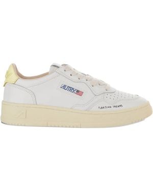 Autry Medalist Low Sneakers In White And Yellow Leather With Handwriti