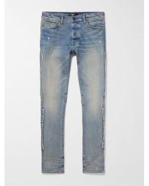 Amiri 3D Bones Skinny Jeans mit Applikationen und Distressed-Details - Blau