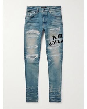 Amiri Hollywood Skinny-fit Logo-flocked Distressed Jeans - Blue