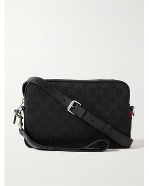 Gucci Leather-Trimmed Monogrammed Canvas Small Crossbody Bag - Black
