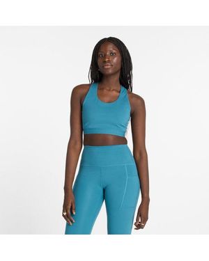 Femme Nb Sleek Medium Support Pocket Sports Bra En Poly Knit Taille New Balance en coloris Noir Lyst