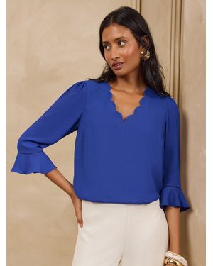 Love & Roses Cobalt Scallop V-Neck Flute Sleeve Blouse - Blue