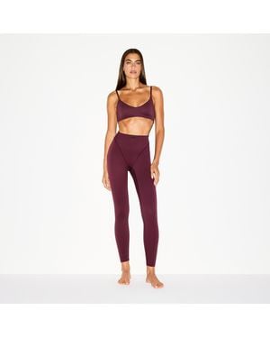 Nike Skims Matte High-Waisted V-Line 26" Leggings - Orange