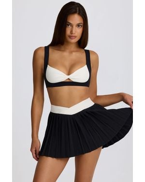 BO+TEE Soft Active Crossover Pleated Mini Skort - Black