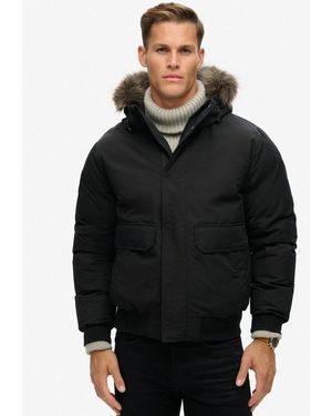 Superdry Steppjacke Everest Faux Fur Bomber Jacket Mit Lockerer Passform, Unifarbenes Design - Schwarz