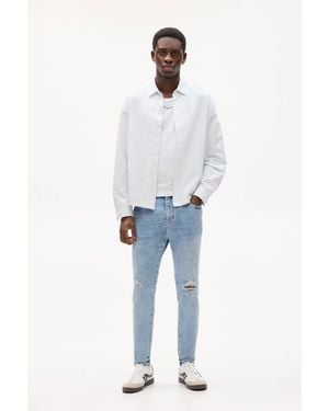 Pull&Bear Carrot Fit Jeans Zierrisse - Blau