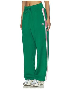 Champion PANTALON JAMBES LARGES TENNIS COURT en Green - Vert