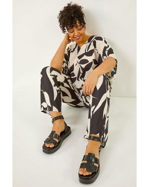 Roman Curve Leaf Print Stretch Trousers - Black