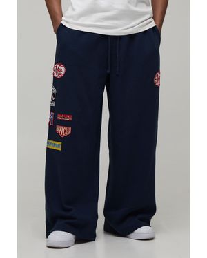 BoohooMAN Extreme Wide Leg Drop Crotch Moto Badge Jogger - Blue