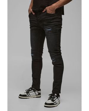 BoohooMAN Skinny Stretch True Pu Biker Rip & Repair Jeans - Black