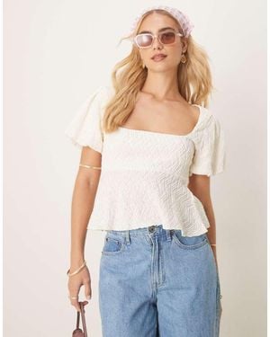 Gina Tricot Wavy Textured Jersey With Puff Sleeves And Peplum Hem - Blue