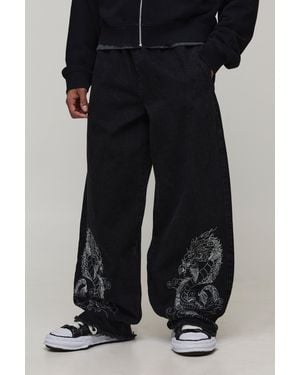 BoohooMAN Dragon Embroidered Elasticated Waist Super Baggy Fit Jeans - Black