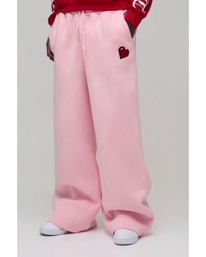 BoohooMAN Tall Wide Leg Heart Printed Jogger - Pink
