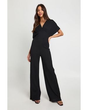 Boohoo Textured Plunge Batwing Wide Leg Jumpsuit - Blue