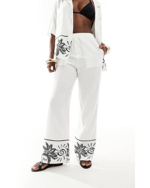 The Couture Club The Co-Ord Palm Print Embroidery Wide Leg Trousers - White