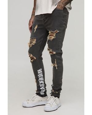 BoohooMAN Tall Stacked Skinny Distressed Embroidered Gusset Jeans - Black
