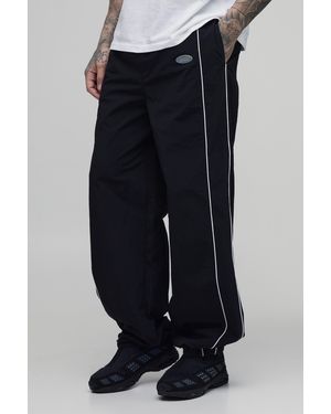 BoohooMAN Tall Relaxed Fit Elasticated Front Binding Toggle Hem Track Trousers - Black