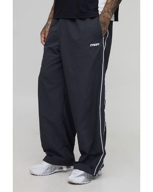 BoohooMAN Tall Stripe Embroidered Parachute Trousers - Blue