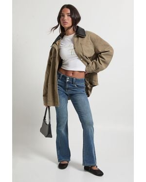 Boohoo Petite Low Waist Double Button Flared Jean - Blue